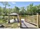 Scenic waterfront dock with a charming gazebo, providing a serene spot to enjoy the surrounding nature at 701 Mask Rd, Brooks, GA 30205