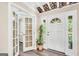 Inviting foyer with a stylish front door and glass-paneled French doors at 701 Mask Rd, Brooks, GA 30205