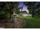 Charming exterior view of home surrounded by mature trees and lush landscaping at 701 Mask Rd, Brooks, GA 30205