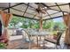 Cozy outdoor dining area under a gazebo, featuring comfortable seating for enjoying the open air at 701 Mask Rd, Brooks, GA 30205