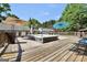 Inviting wooden deck featuring a hot tub with umbrellas, perfect for relaxation and outdoor enjoyment at 701 Mask Rd, Brooks, GA 30205