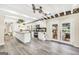 Bright and spacious kitchen featuring white cabinets, an island, and stainless steel appliances overlooking the backyard at 701 Mask Rd, Brooks, GA 30205