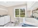 Functional laundry room equipped with Maytag appliances, a window with a view, and ample counter space at 701 Mask Rd, Brooks, GA 30205