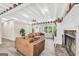 Spacious living room with fireplace, hardwood floors, and beamed ceilings at 701 Mask Rd, Brooks, GA 30205