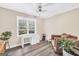 Cozy office space with a ceiling fan, neutral walls, and abundant natural light at 701 Mask Rd, Brooks, GA 30205
