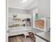 Well-organized pantry with ample shelving and storage space, illuminated by a window with natural light at 701 Mask Rd, Brooks, GA 30205