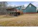 Backyard featuring a screened-in porch and spacious wooden deck at 4186 Highway 138 Sw, Stockbridge, GA 30281