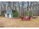 A cozy backyard featuring a shed and a relaxing seating area perfect for outdoor gatherings at 4186 Highway 138 Sw, Stockbridge, GA 30281