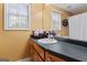 Bright bathroom featuring a large mirror, vanity, and natural light at 4186 Highway 138 Sw, Stockbridge, GA 30281