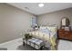 Neutral bedroom with a white iron bed frame and a patterned bench at 4186 Highway 138 Sw, Stockbridge, GA 30281