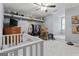 Bedroom featuring a crib, dresser, and shelving displaying memorabilia at 4186 Highway 138 Sw, Stockbridge, GA 30281