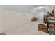 Large bonus room with neutral carpet and lots of natural light at 4186 Highway 138 Sw, Stockbridge, GA 30281