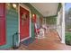 Charming front porch with rocking chairs and swing, perfect for enjoying quiet moments outdoors at 4186 Highway 138 Sw, Stockbridge, GA 30281