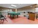 Large game room featuring a ping pong table and a convenient bar area with seating at 4186 Highway 138 Sw, Stockbridge, GA 30281