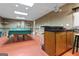 Spacious game room with a ping pong table and a bar area for entertainment at 4186 Highway 138 Sw, Stockbridge, GA 30281