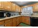 Kitchen with wood cabinets, ample counter space, modern appliances, and tile backsplash at 4186 Highway 138 Sw, Stockbridge, GA 30281