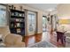 Bright living room with wood floors, large windows, and neutral decor providing a warm and inviting ambiance at 4186 Highway 138 Sw, Stockbridge, GA 30281