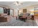 A spacious living room with hardwood floors, neutral paint and comfortable furniture at 4186 Highway 138 Sw, Stockbridge, GA 30281