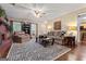 Spacious living room with a brick fireplace, hardwood floors, and comfortable seating at 4186 Highway 138 Sw, Stockbridge, GA 30281