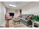 Cozy living room with a comfortable couch, patterned armchair, wicker table, and natural light at 4186 Highway 138 Sw, Stockbridge, GA 30281