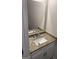 Stylish half bathroom featuring granite countertop and a modern vanity at 606 Gardner Rd, Stockbridge, GA 30281