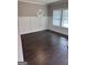 Elegant dining room featuring modern chandelier and large windows for plenty of natural light at 606 Gardner Rd, Stockbridge, GA 30281