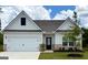 Charming single-story home with a two-car garage and well-manicured lawn at 423 Prescott Way, Villa Rica, GA 30180