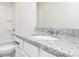 Bathroom featuring granite countertop, white cabinetry, and a shower and bath combo at 431 Prescott Way, Villa Rica, GA 30180