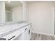Bathroom featuring a granite countertop with white cabinets and modern black hardware at 438 Prescott Way, Villa Rica, GA 30180