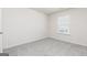 Carpeted bedroom featuring natural light from one window at 438 Prescott Way, Villa Rica, GA 30180