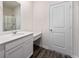 Bathroom featuring vanity with white cabinets, and mirror with door on right at 442 Prescott Way, Villa Rica, GA 30180