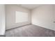 Empty bedroom with carpet, white walls and a window with mini-blinds at 442 Prescott Way, Villa Rica, GA 30180