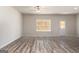 Inviting living space with durable floors, a ceiling fan, and a bright window, perfect for relaxation and comfort at 442 Prescott Way, Villa Rica, GA 30180