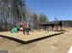 Community playground featuring modern play equipment and picnic shelter for outdoor recreation at 442 Prescott Way, Villa Rica, GA 30180
