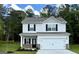 Charming two-story home features a two-car garage, black shutters, and a well-manicured lawn at 467 Prescott Way, Villa Rica, GA 30180