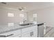 Granite kitchen island with stainless steel dishwasher and undermount sink at 439 Prescott Way, Villa Rica, GA 30180