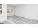 Bright room with large window and wood-style flooring at 445 Prescott Way, Villa Rica, GA 30180