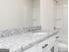 Bright bathroom with granite countertops, white cabinets, and a shower/tub combo at 448 Prescott Way, Villa Rica, GA 30180