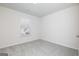 Bright bedroom featuring neutral carpet, white walls, and a window at 448 Prescott Way, Villa Rica, GA 30180
