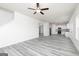 Bright open floor plan connects the living room to the kitchen, featuring light gray wood floors at 448 Prescott Way, Villa Rica, GA 30180