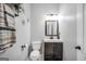 Cozy powder room featuring modern lighting and a stylish mirror, creating an inviting space at 242 Greenland Dr, Mcdonough, GA 30253