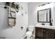 Cozy powder room featuring modern lighting and a stylish mirror, creating an inviting space at 242 Greenland Dr, Mcdonough, GA 30253