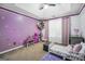Adorable ' bedroom with purple walls, decorative touches, and carpet flooring at 242 Greenland Dr, Mcdonough, GA 30253