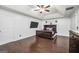 This cozy bedroom features hardwood floors, tray ceiling, and natural light at 242 Greenland Dr, Mcdonough, GA 30253