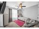 Relaxing bedroom with a ceiling fan, area rug, and lots of natural light at 242 Greenland Dr, Mcdonough, GA 30253