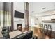 Cozy living room with fireplace, high ceilings, and open layout to the kitchen at 242 Greenland Dr, Mcdonough, GA 30253