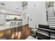 Open-concept living room with fireplace, high ceilings, and seamless flow to the kitchen at 242 Greenland Dr, Mcdonough, GA 30253