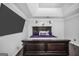 Comfortable main bedroom featuring a dark wood bed frame and decorative accents at 242 Greenland Dr, Mcdonough, GA 30253