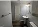 Bathroom featuring a pedestal sink, a decorative mirror, and light gray walls at 2353 Wellington Cir, Lithonia, GA 30058
