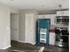 Modern kitchen featuring stainless steel appliances, white cabinets and modern laminate flooring at 2353 Wellington Cir, Lithonia, GA 30058